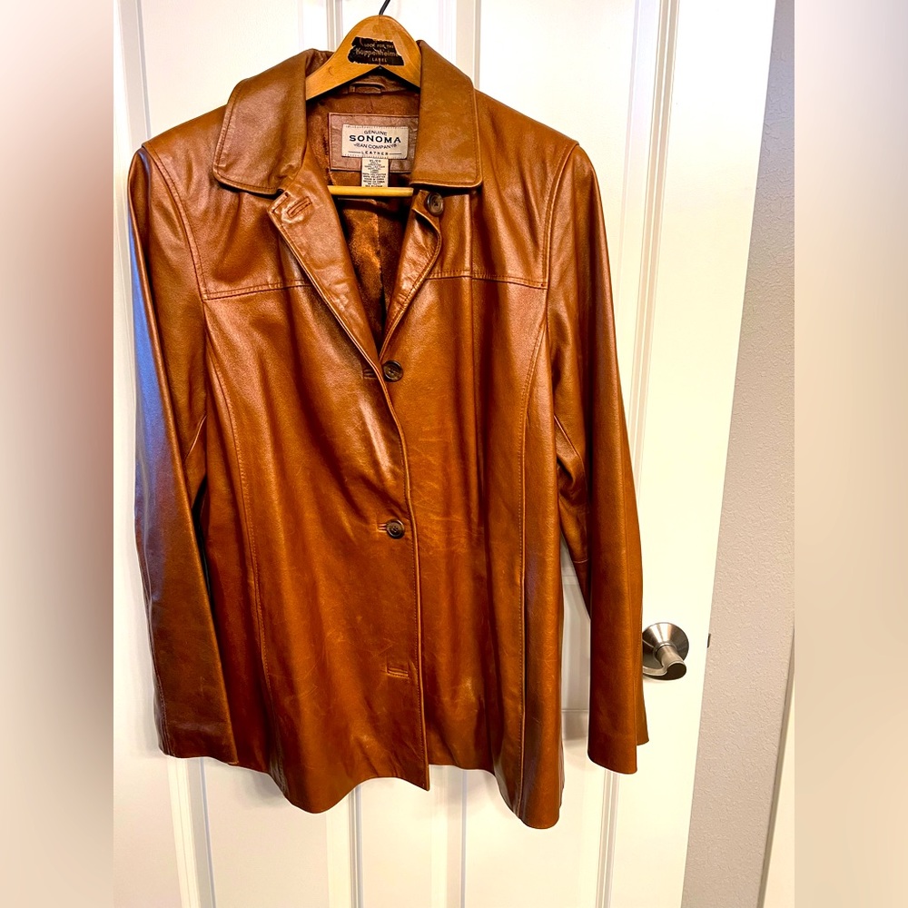 Women’s brown leather jacket.